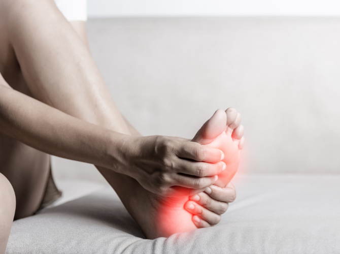 Athlete experiencing foot pain. It's important for athletes to maintain healthy feet. 
