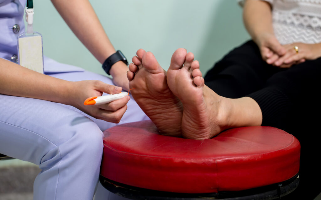 Podiatrist treating a patient with quality diabetic footcare.  