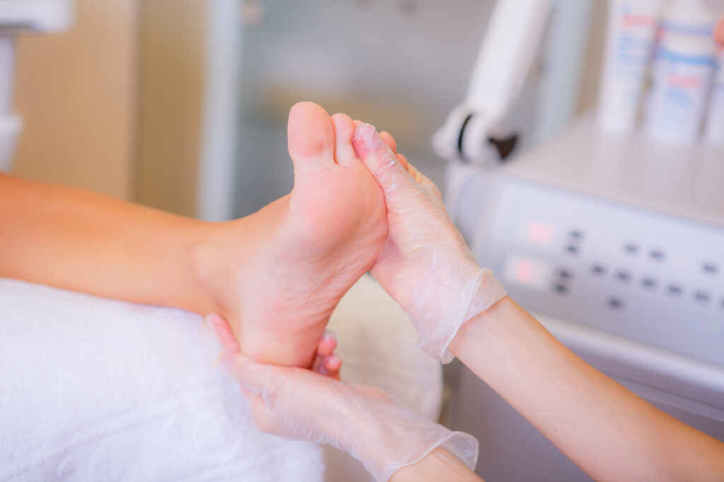 Photo capturing a podiatrist ensuring that a patient's foot are in excellent health. 